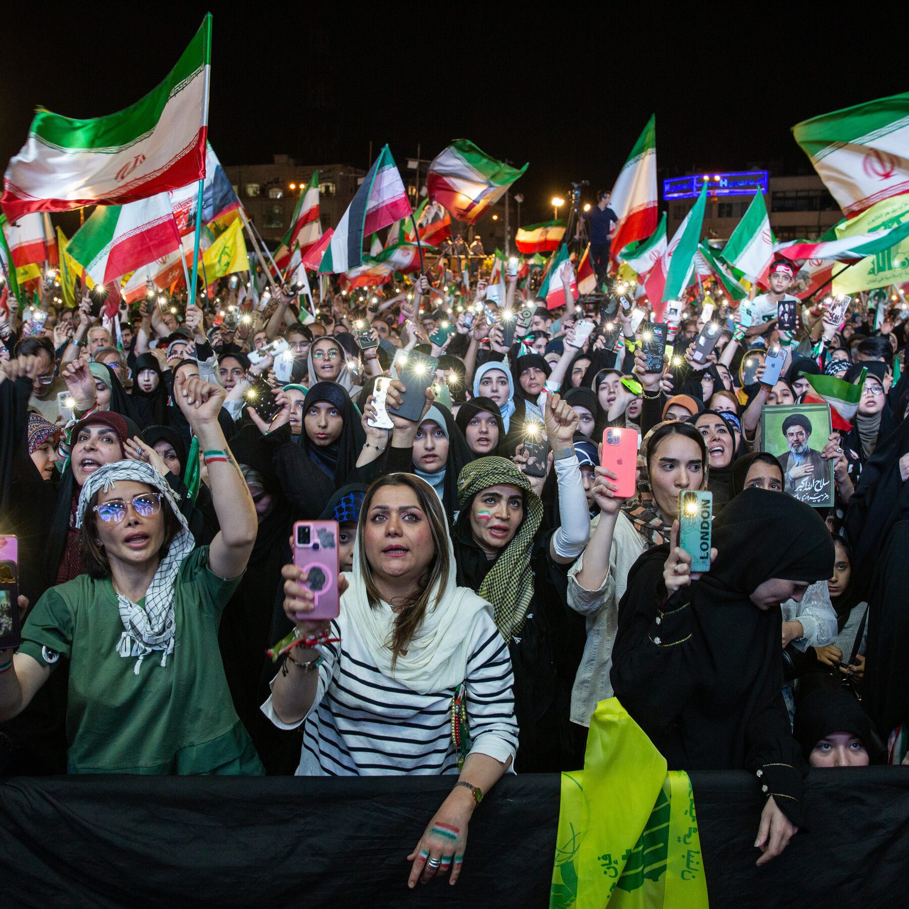 Iran’s government promotes nationalism, includes unveiled women.
