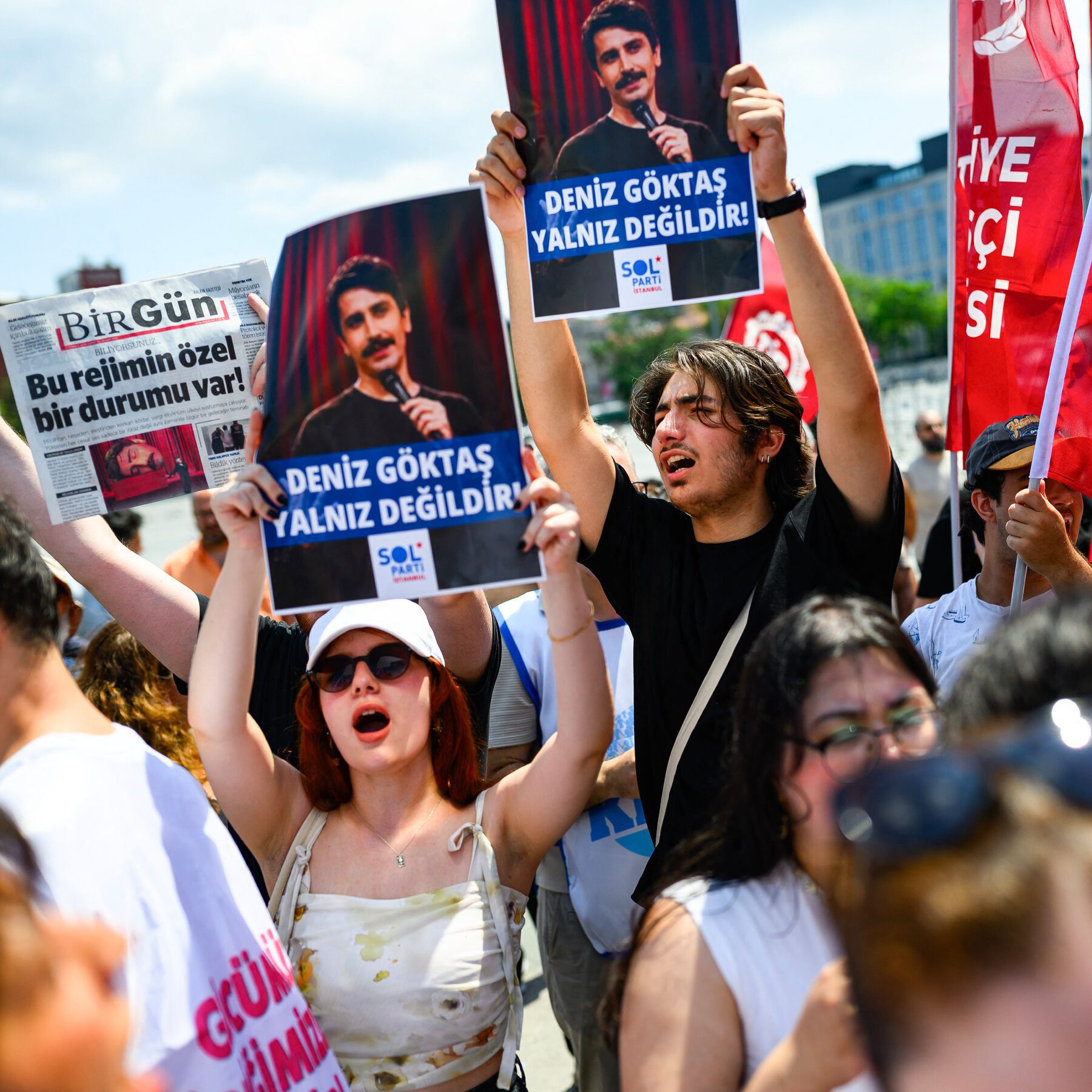 Turkey holds NATO summit while cracking down on critics
