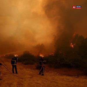 Hundred of thousands flee as wildfires spread in Spain and France.