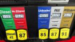 Inflation cooled slightly last month even as consumers stepped up spending